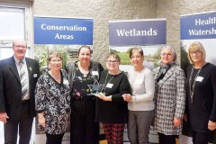 Members of the Centre Ipperwash Community Association receive their Conservation Award from Vice-Chair, Lorie Scott (third from left) and Chair, Pat Brown (far left).  