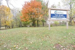 Clark-Wright Conservation Area Entrance sign with trees behind