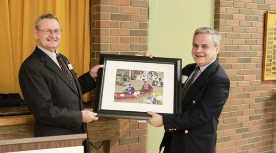 Andy Bruziewicz (right), outgoing Chair for the SCRCA is presented with a gift by Norm Giffen, outgoing Vice Chair