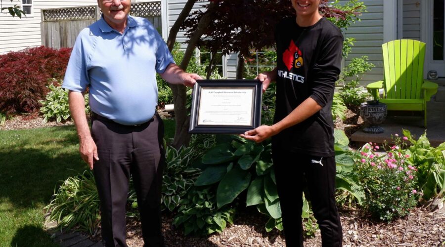 Joe Faas (left) presents Brady Grubb (right) with the A.W. Campbell Conservation Scholarship.