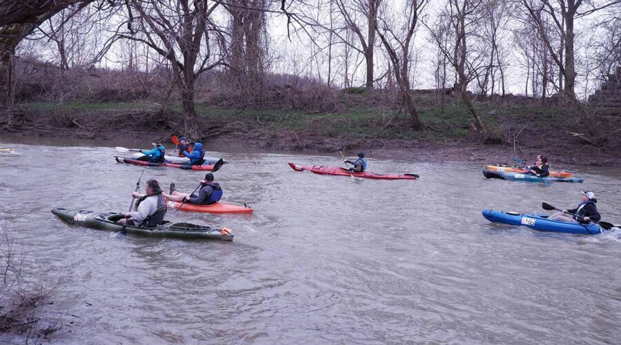 Race participants in their kayaks on the Sydenham River